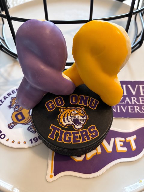 Purple and gold cookies for a school celebration